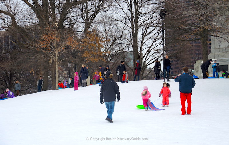 Sledding down a small hill on Boston Common - popular winter activity