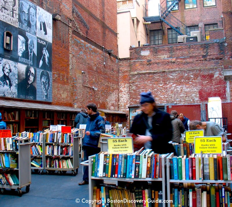 Browsing through books in Brattle Book Store's open air market next to the store