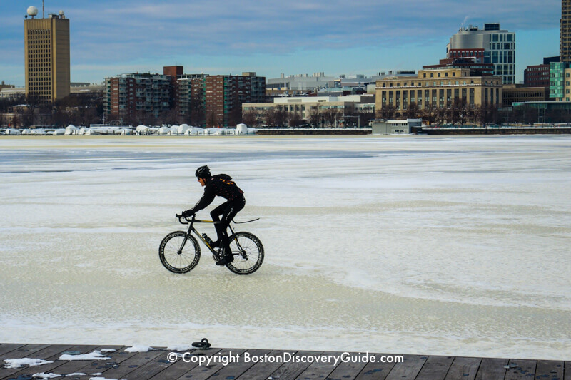 Riding a bicycle across the frozen Charles River