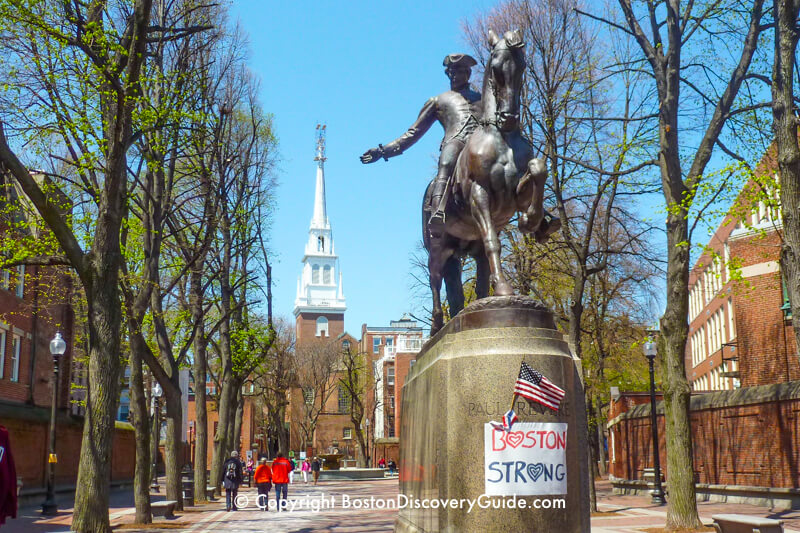 Paul Revere Statue in Boston's North End, with Old North Church in the background