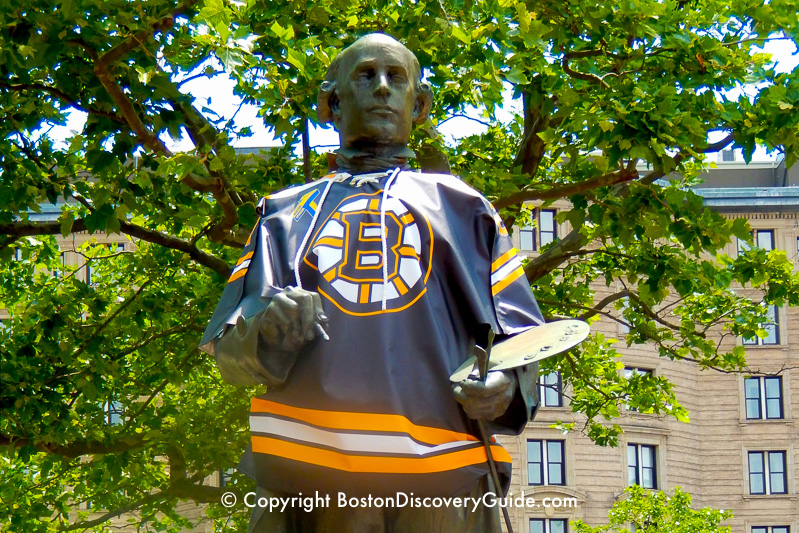 John Singleton Copley statue dressed in a Bruins shirt in Boston's Copley Square in Back Bay